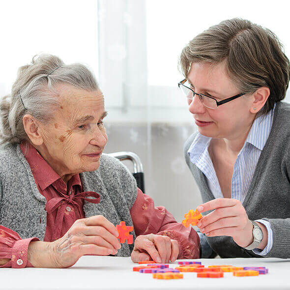 resident and lady enjoying activity